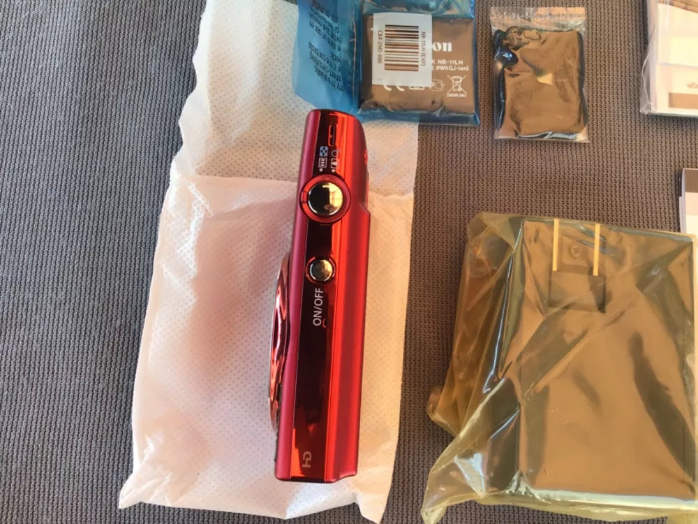 Canon PowerShot ELPH 150 IS (Red) with its original charger (CB-2LF) - cameraavenue